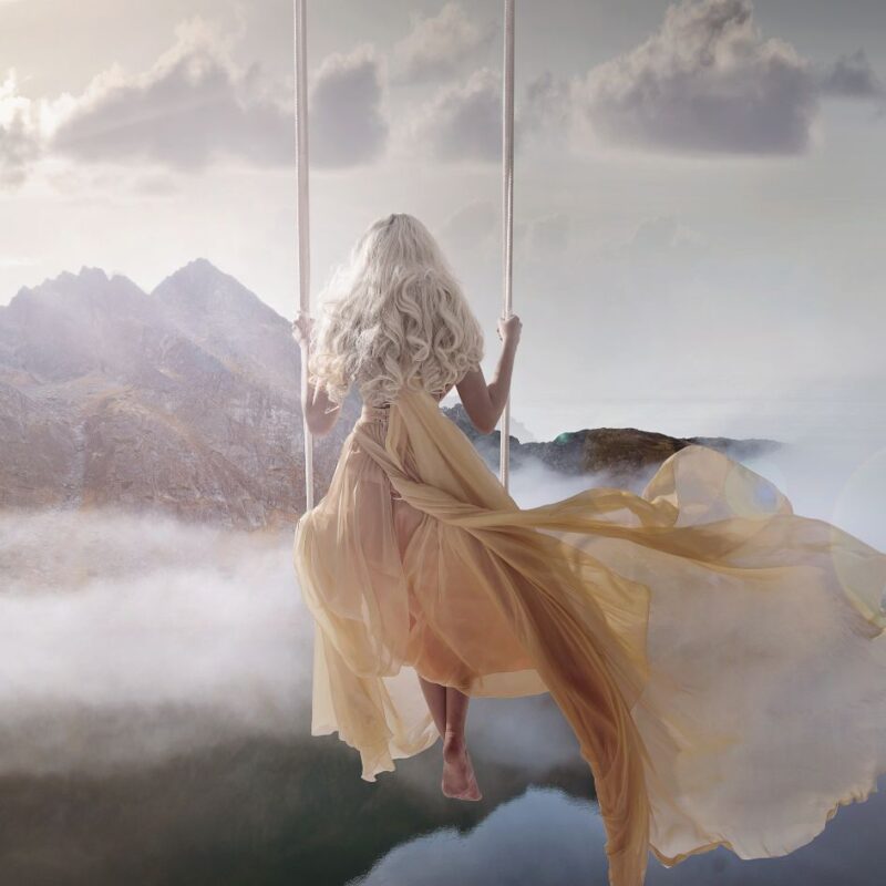 He is Love by Dawn Francis_Rebel-Faith-Poetry_Woman on swing in clouds looking towards mountains